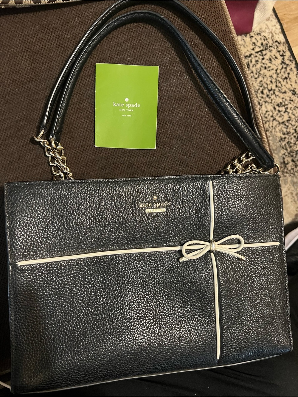 kate spade Black Pebbled Leather Shoulder Bag with Cream Bow Trim